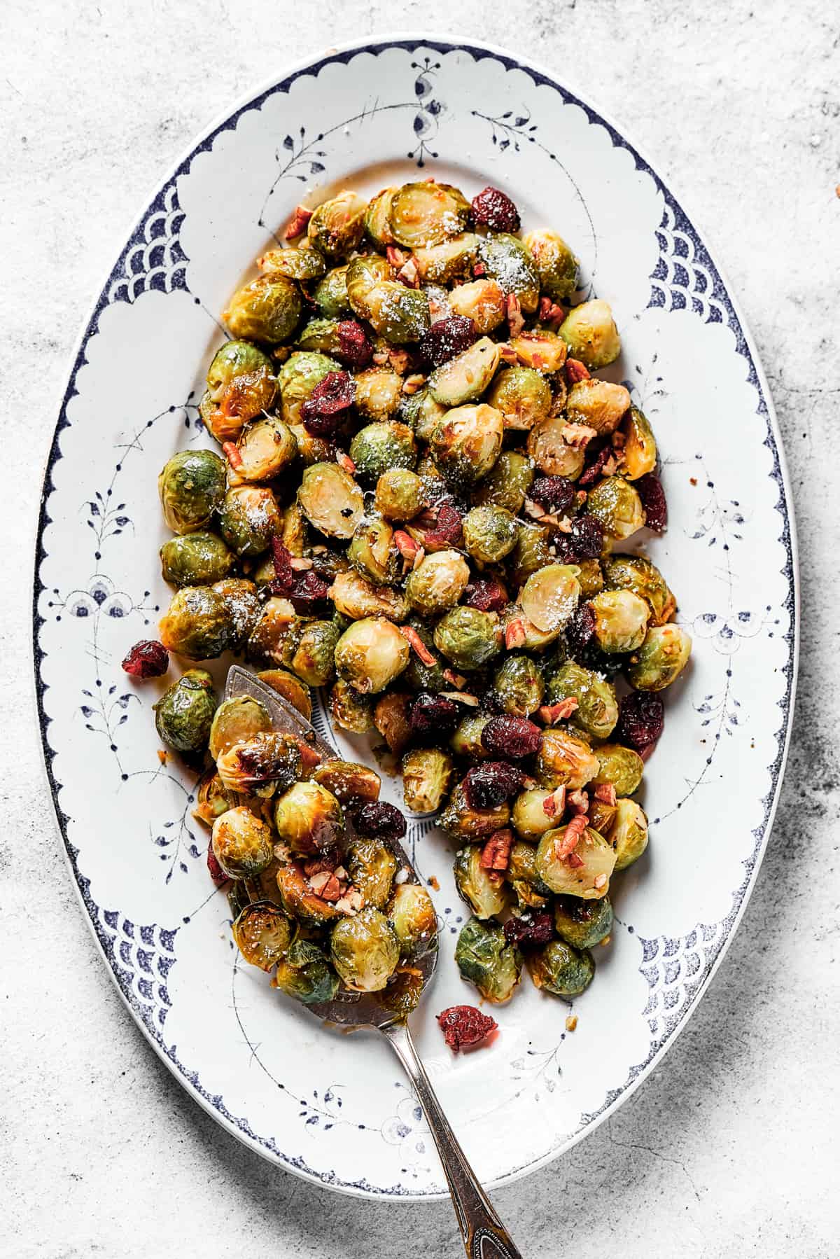 Oval platter with roasted, glazed brussel sprouts.