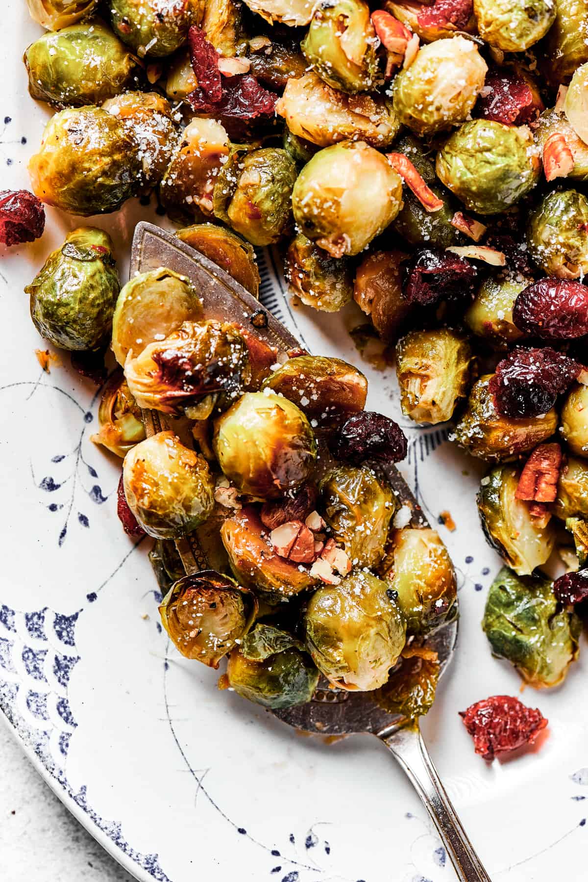 A serving platter loaded with roasted brussels sprouts.