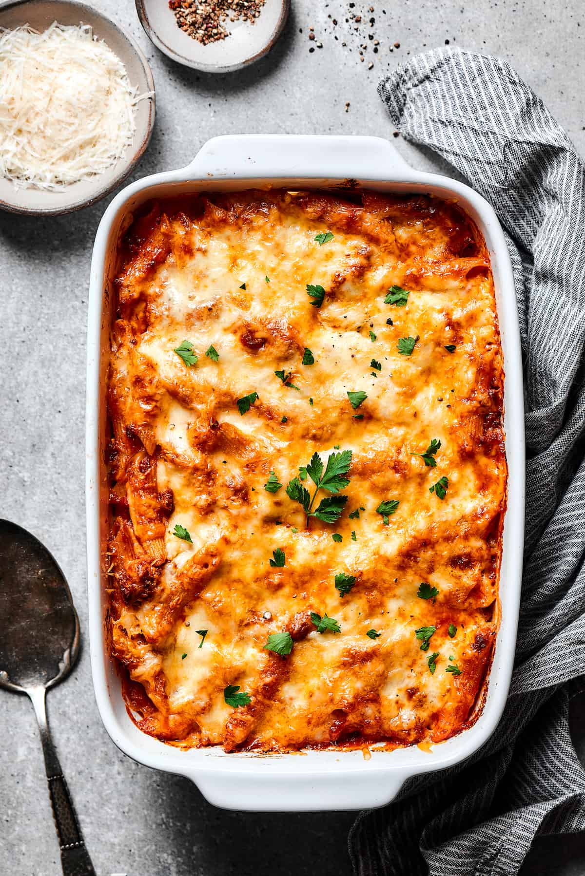 Baked mostaccioli garnished with herbs.