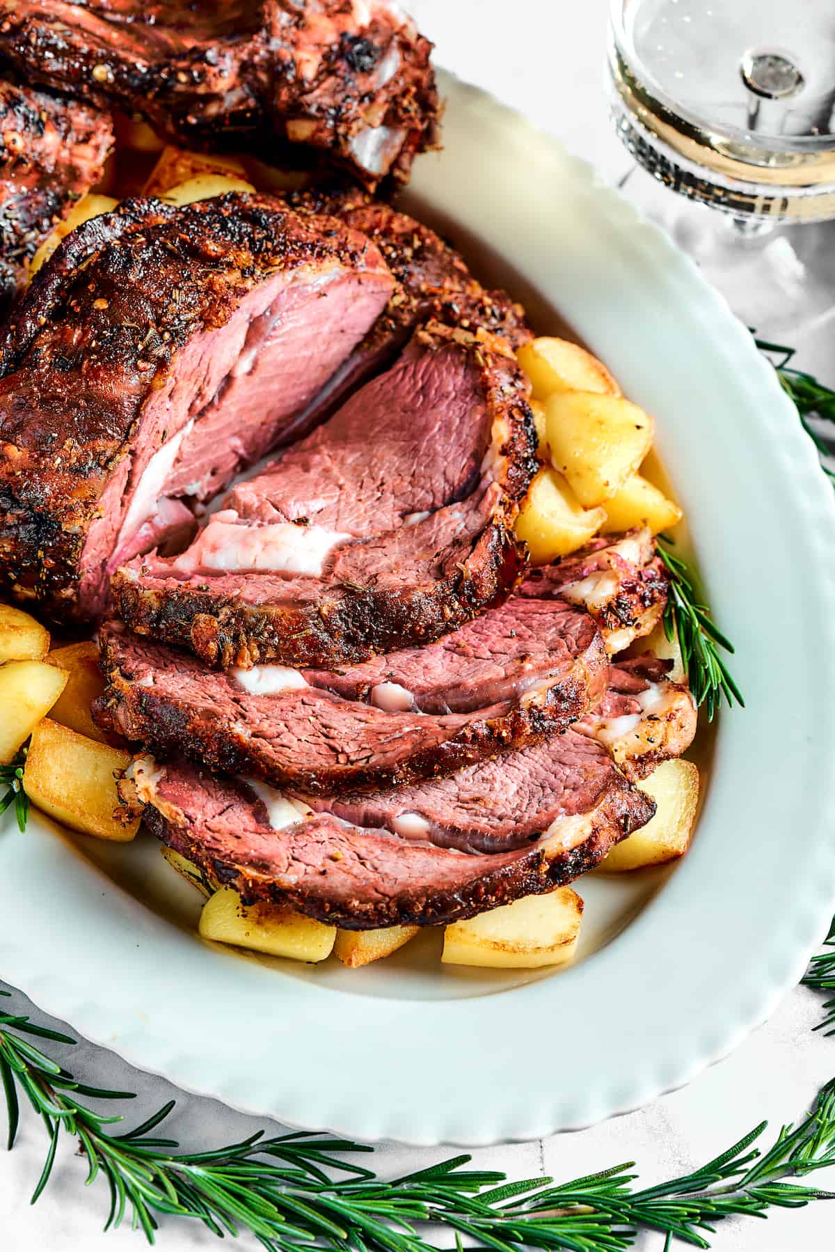 A sliced prime rib roast on a platter.
