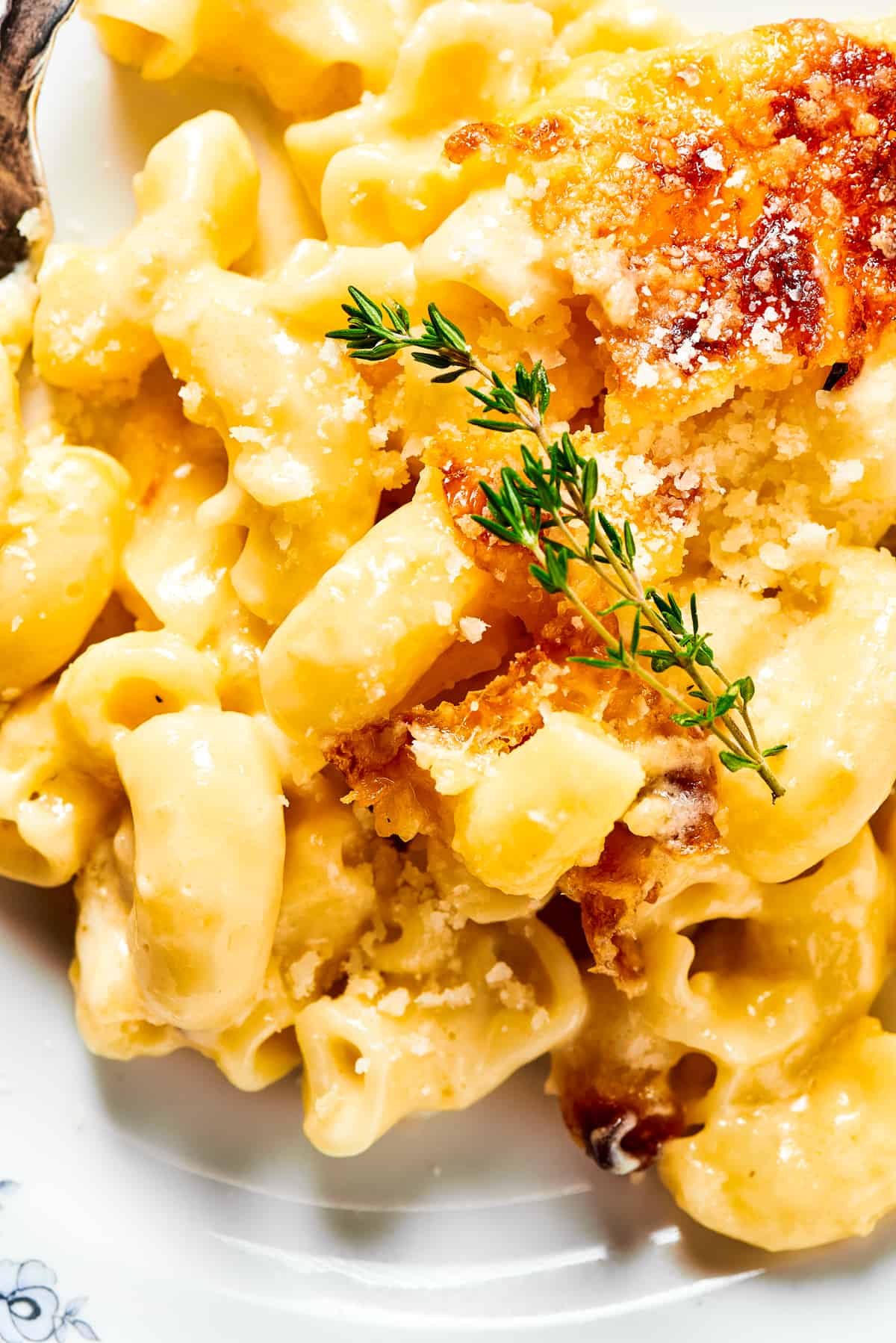 Close-up shot of baked mac and cheese, to show the texture.
