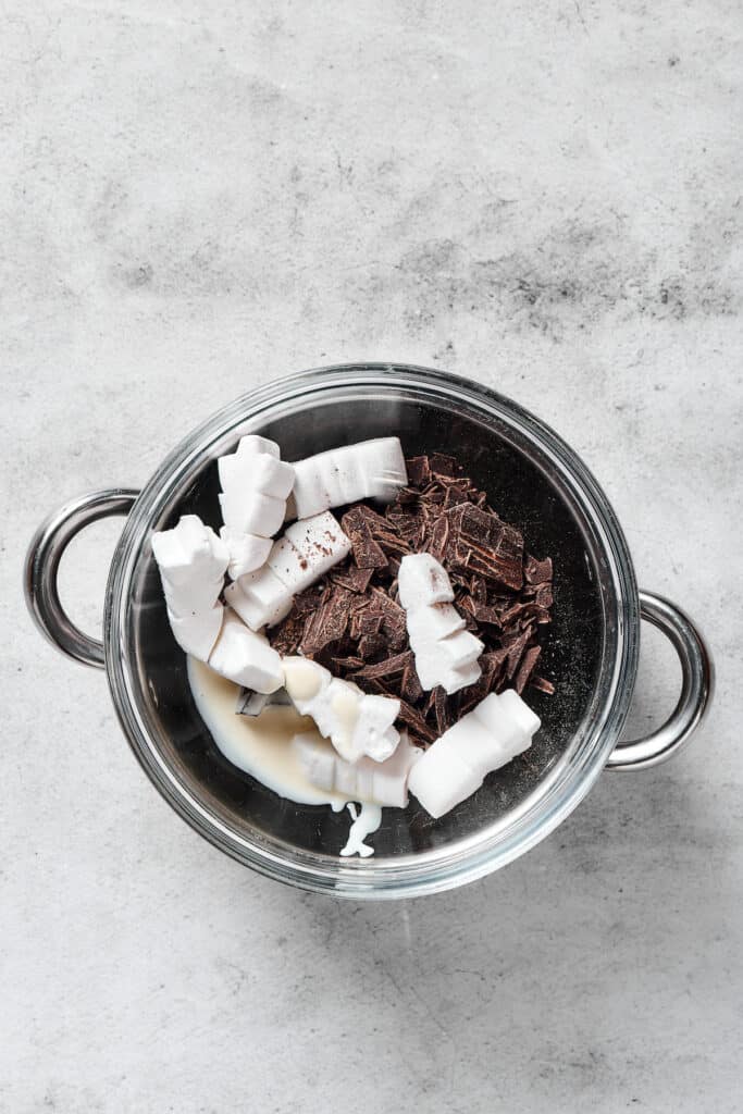Chocolate and marshmallows in a pot.