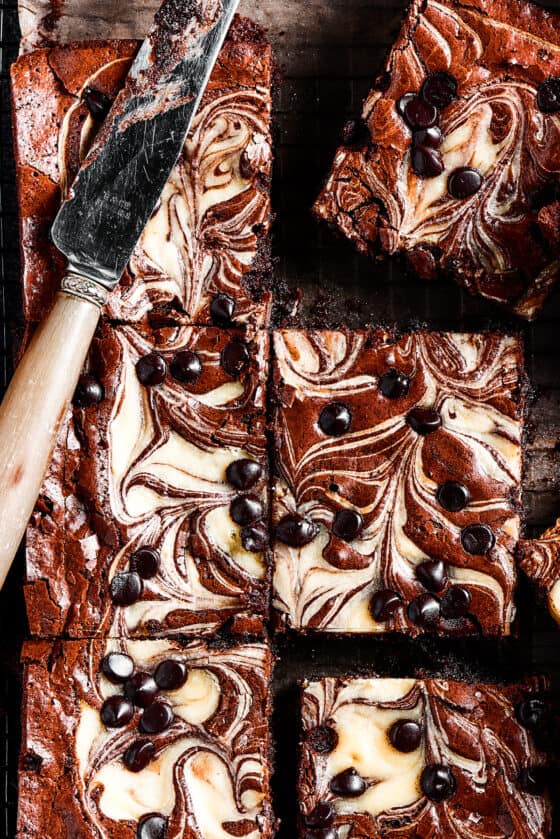 overhead shot of cream cheese swirl brownies dotted with chocolate chips.
