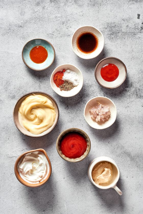 Russian dressing ingredients measured and arranged in small dishes.
