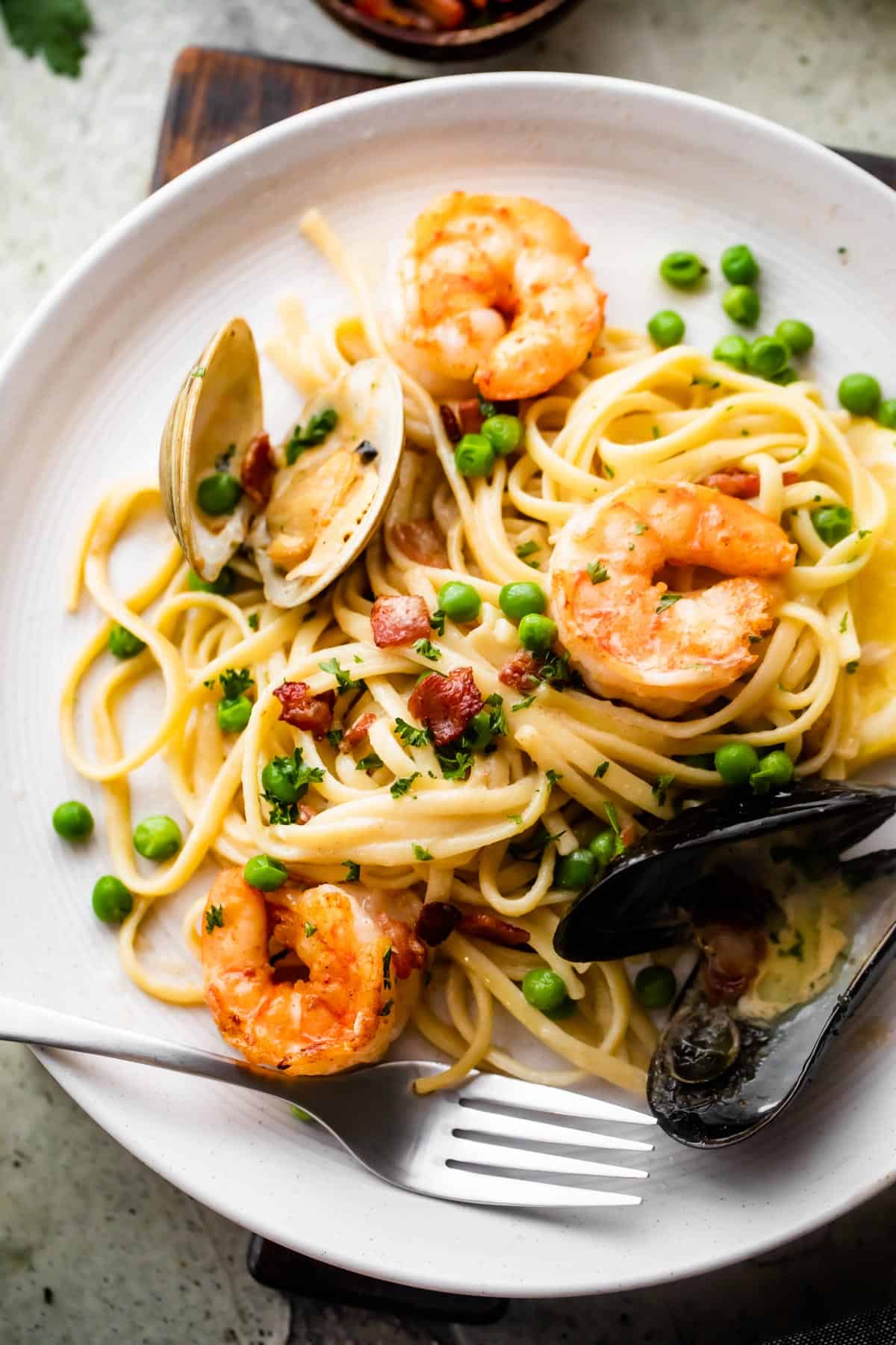 overhead shot of a dinner plate with Creamy Pasta with shrimp and mussels.
