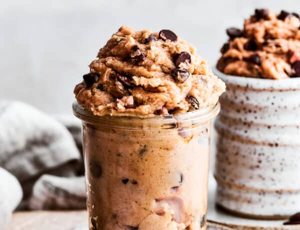 Edible cookie dough placed inside two jars.