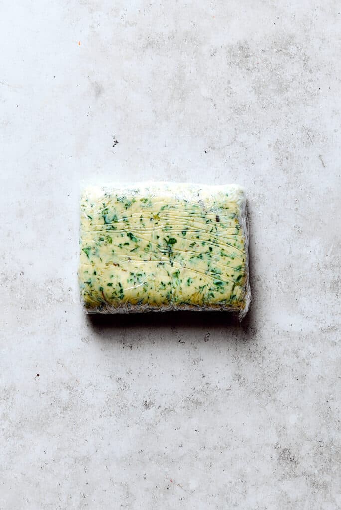 A block of frozen garlic herb butter.