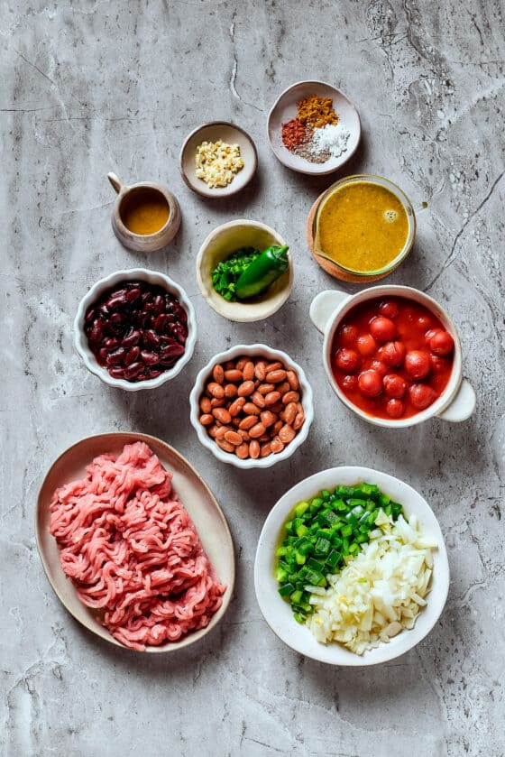 Turkey chili ingredients measured and arranged on a work surface.