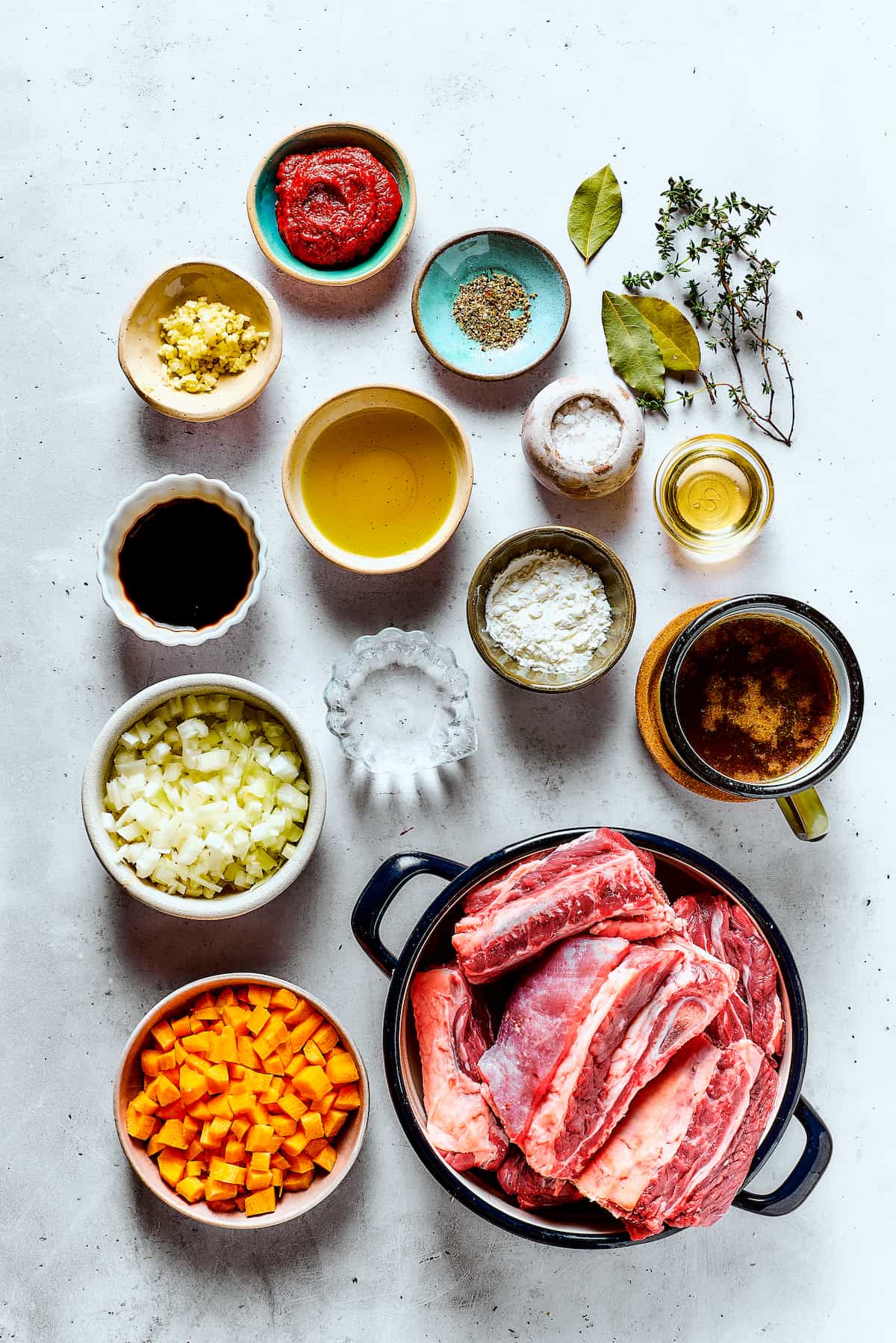 Ingredients for instant pot short ribs, measured and arranged on a table.