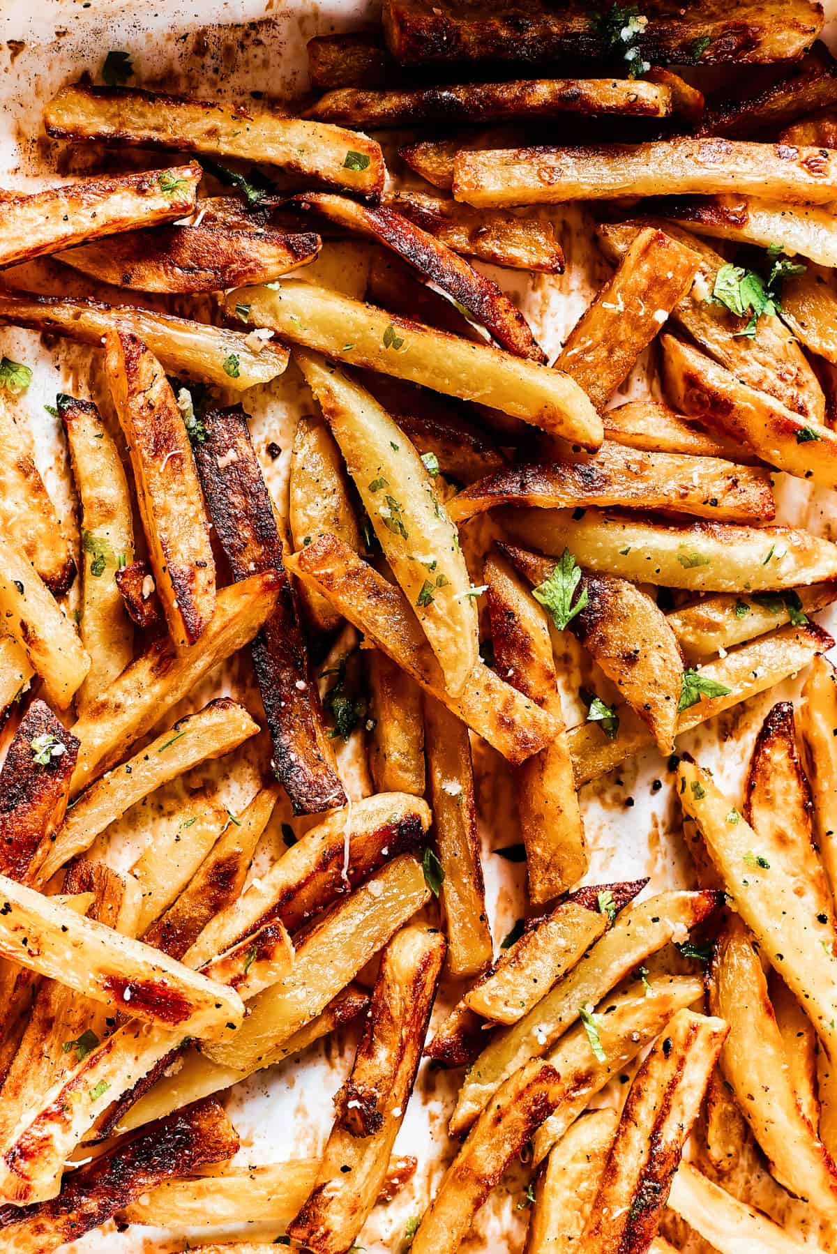 Baked fries drizzled with garlic butter and sprinkled with parsley and parmesan.