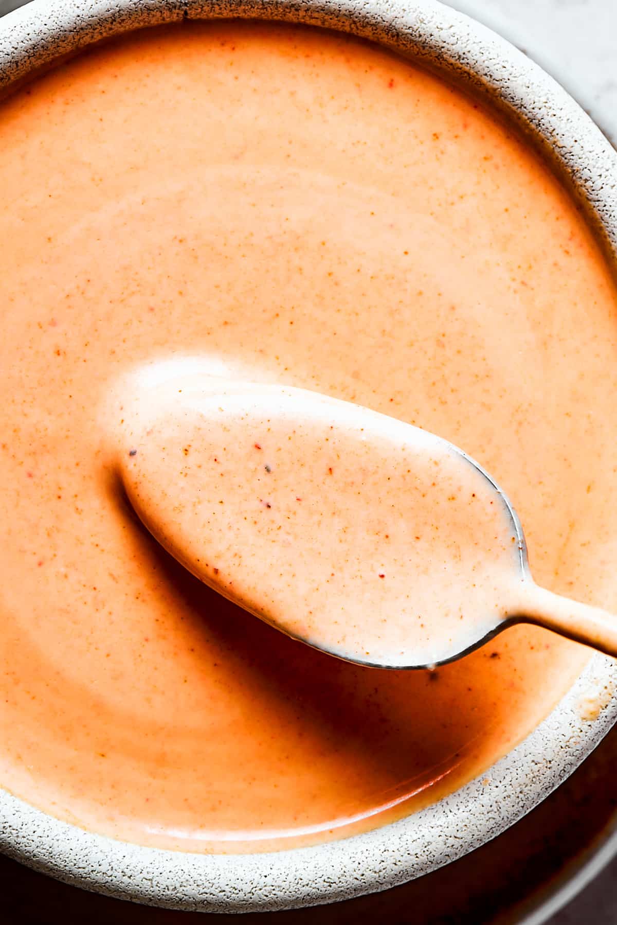 A close-up photo of Homemade yum yum sauce in a bowl.
