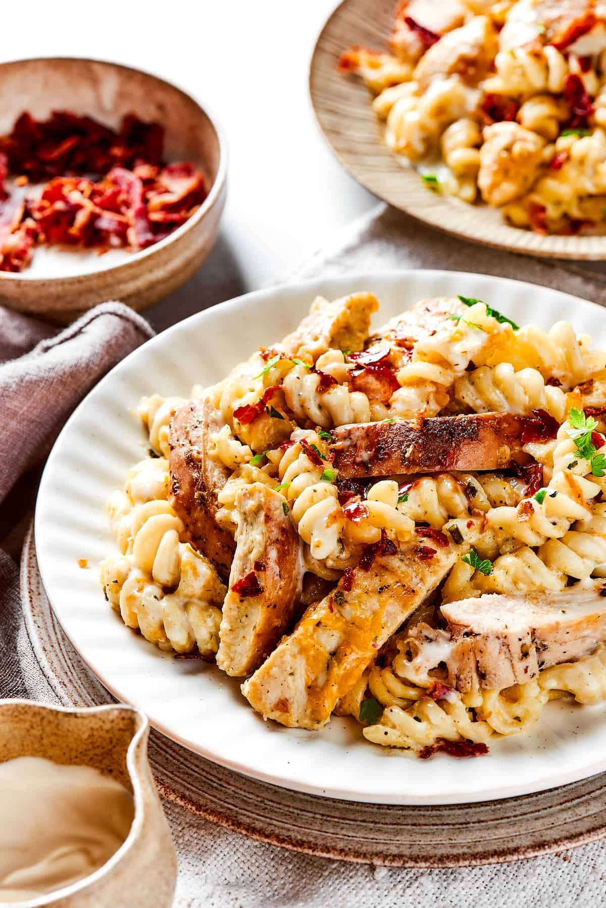 Chicken bacon ranch pasta on dinner plates.