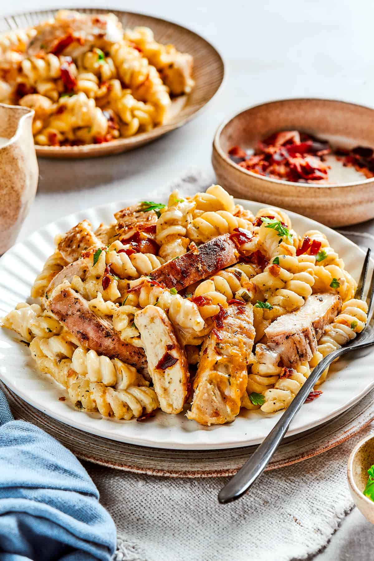 Plates of pasta with chicken.