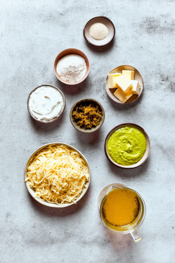 Ingredients for enchilada cheese sauce, measured and arranged on a table.