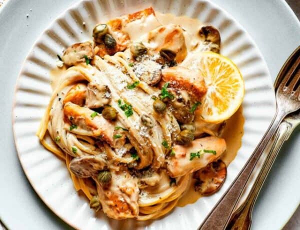 Swirls of pasta in piccata sauce with chicken.
