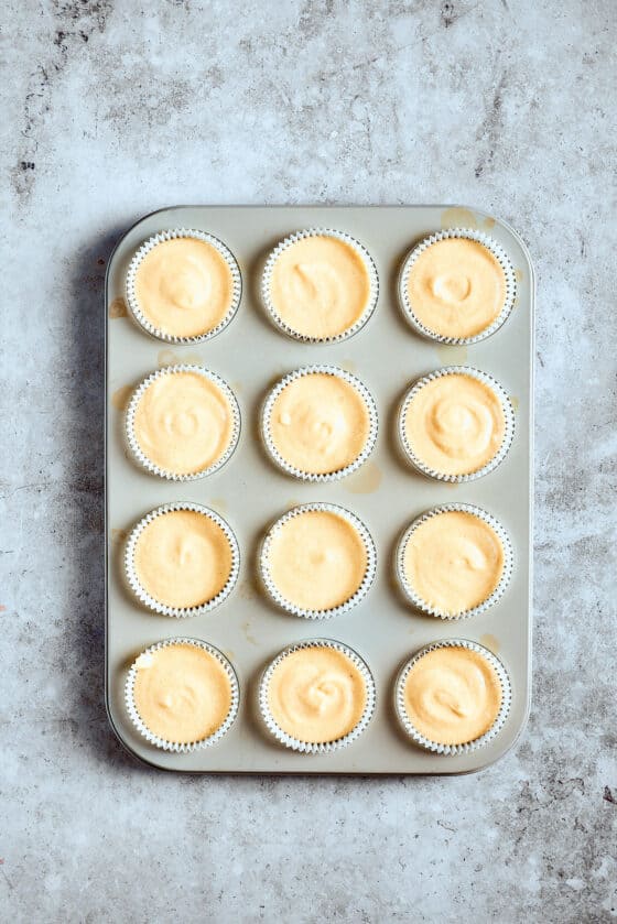 Unbaked cupcakes in a cupcake pan.