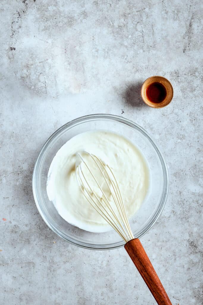 Whipping cream with vanilla to make whipped cream.