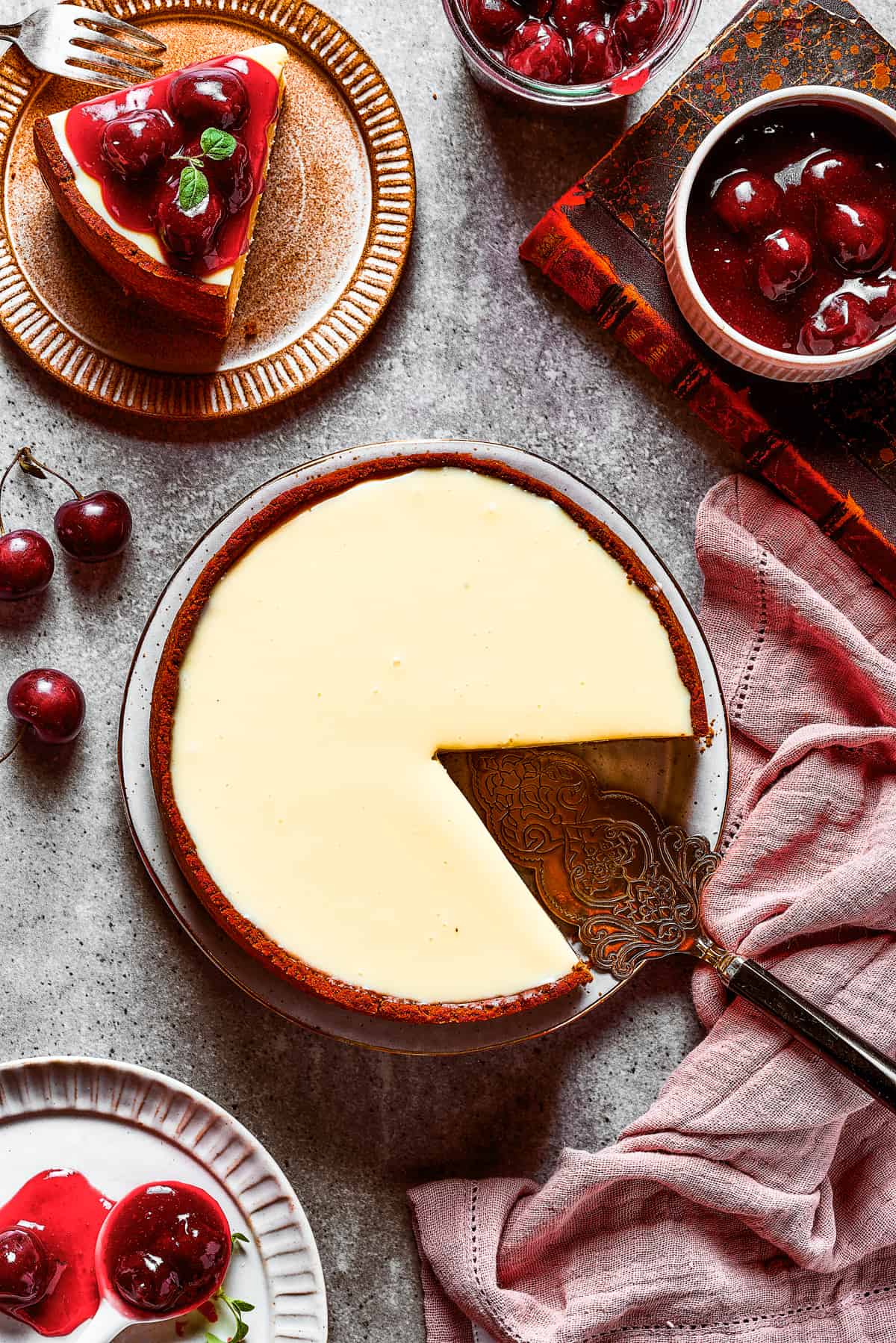 Overhead shot of a cheesecake with a slice removed.