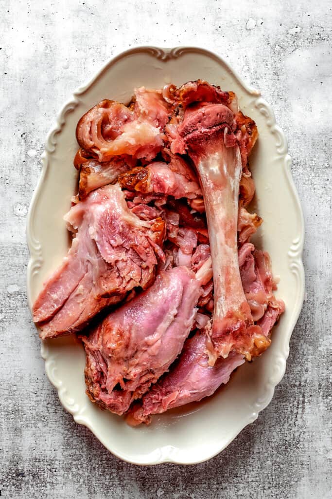 Overhead view of a ham bone on a platter.