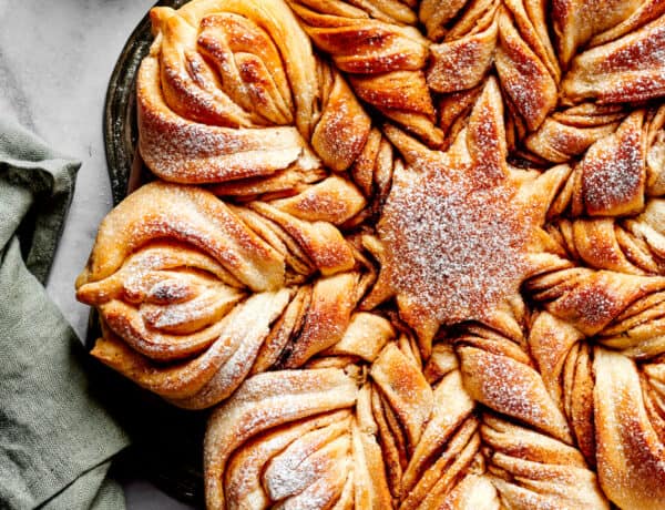 Aerial view of pull-apart star bread topped with powdered sugar.
