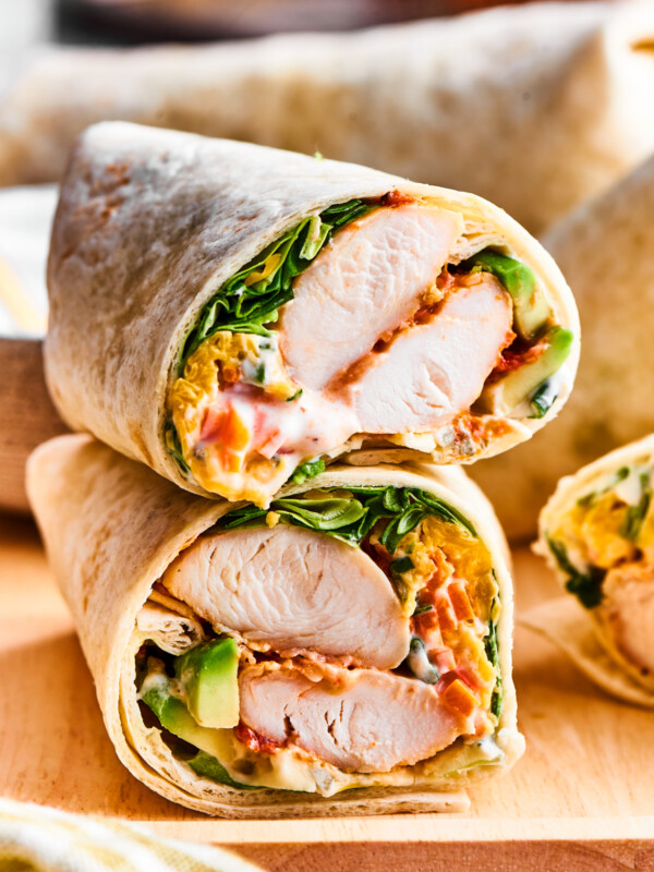 A cut buffalo chicken wrap shows the interior of chicken and vegetables.