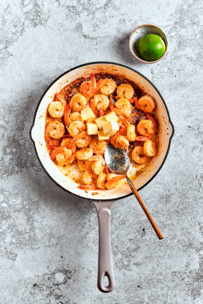 Shrimp is sauteed in a pot.