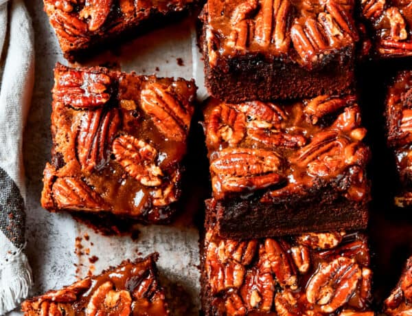 Pecan Pie Brownies lined on parchment paper.