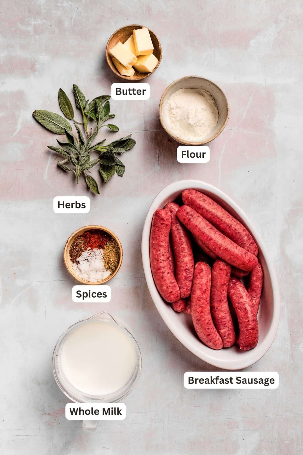 Ingredients for sausage and gravy biscuits are shown: flour, sausage, butter, butter, spices, herbs.