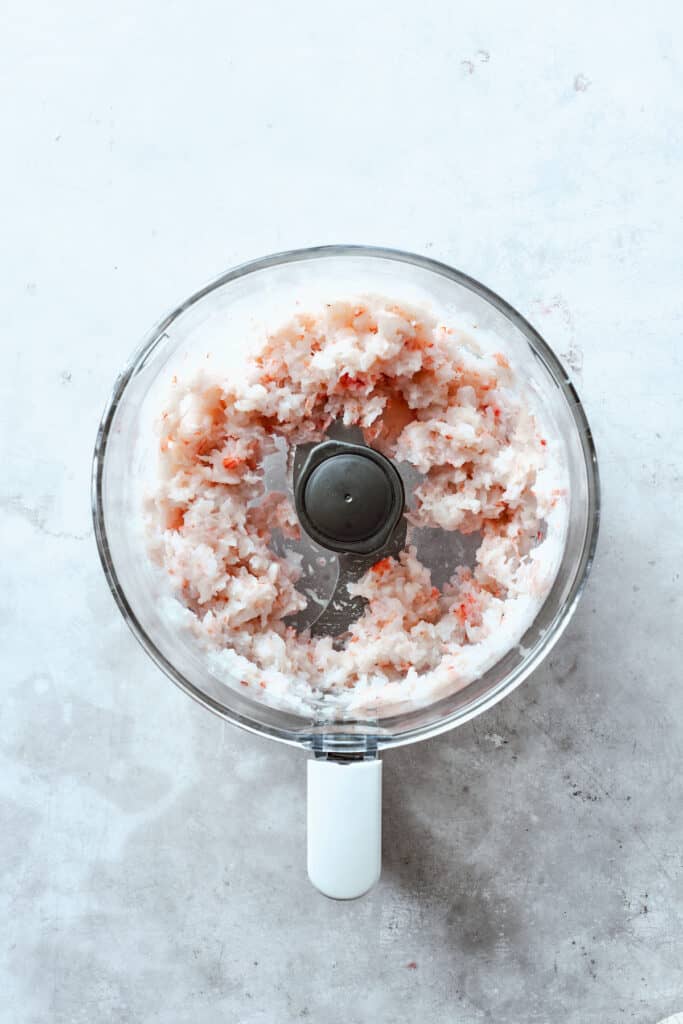 The shrimp is processed in a food processor.
