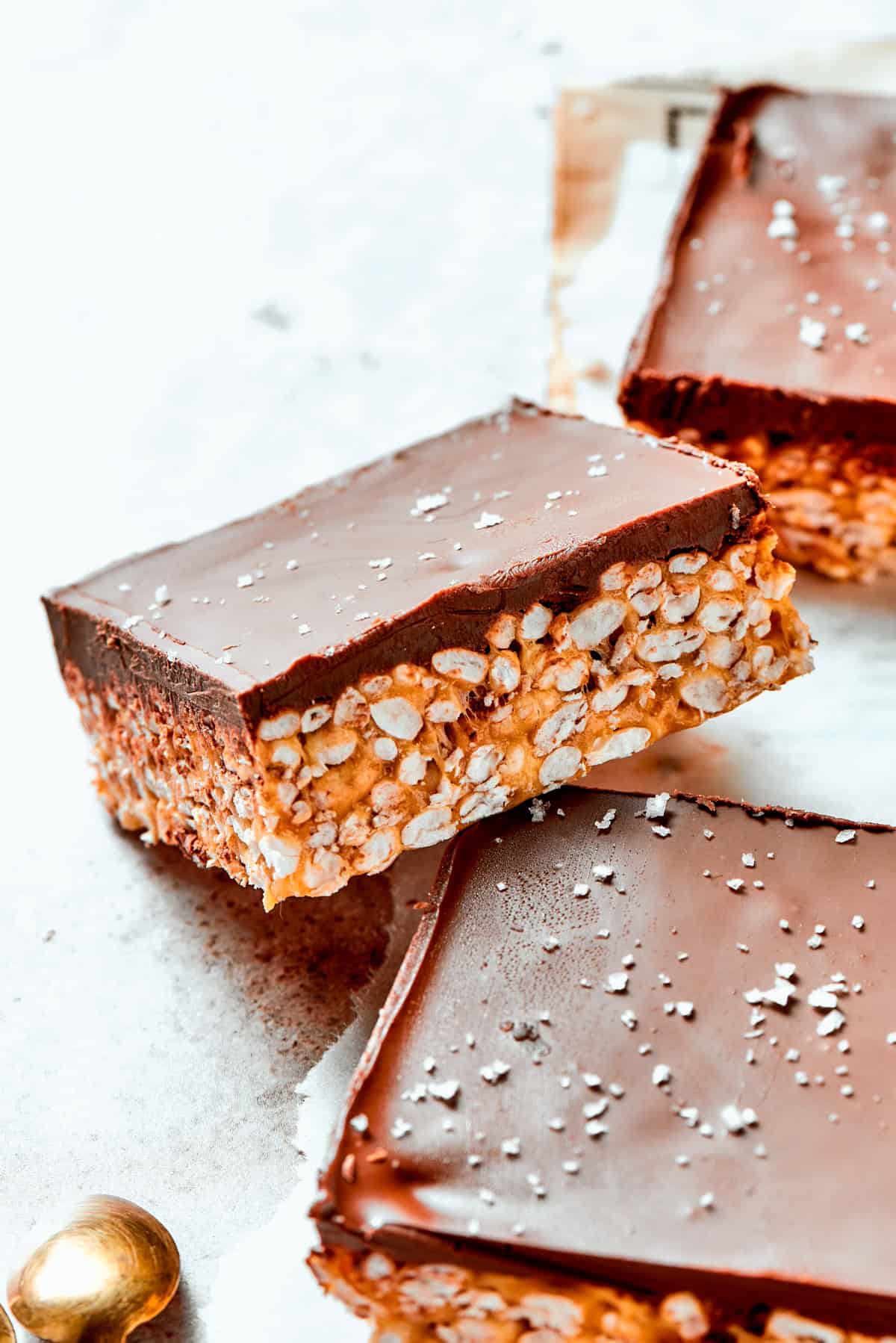 A square bar of rice krispies topped with a layer of melted chocolate.