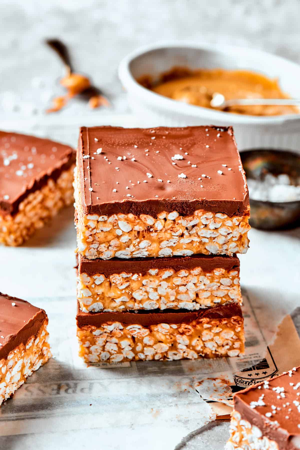 Three crispy rice bars are layered one on top of the other.