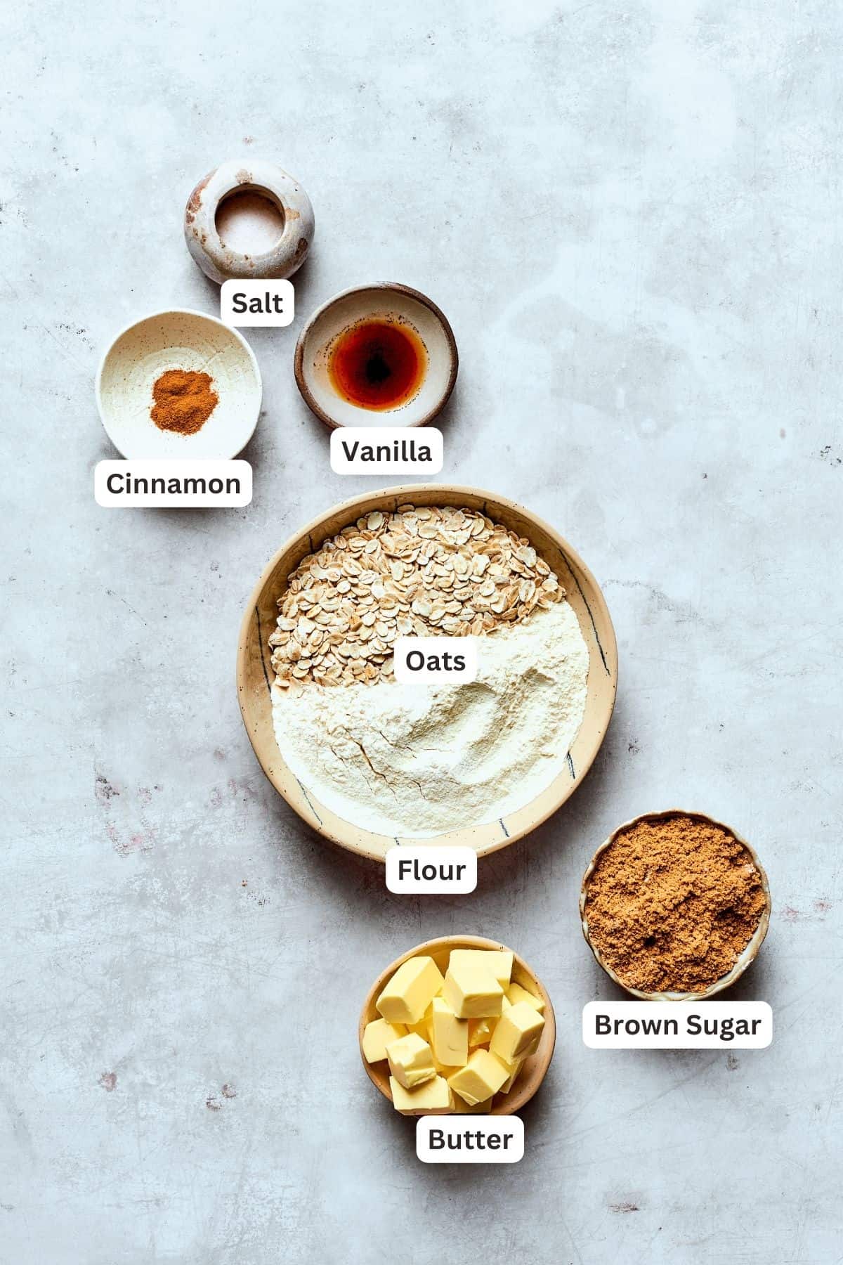 Blueberry crisp topping ingredients are shown labeled: cinnamon, vanbilla, salt, flour, oats, butter, brown sugar.