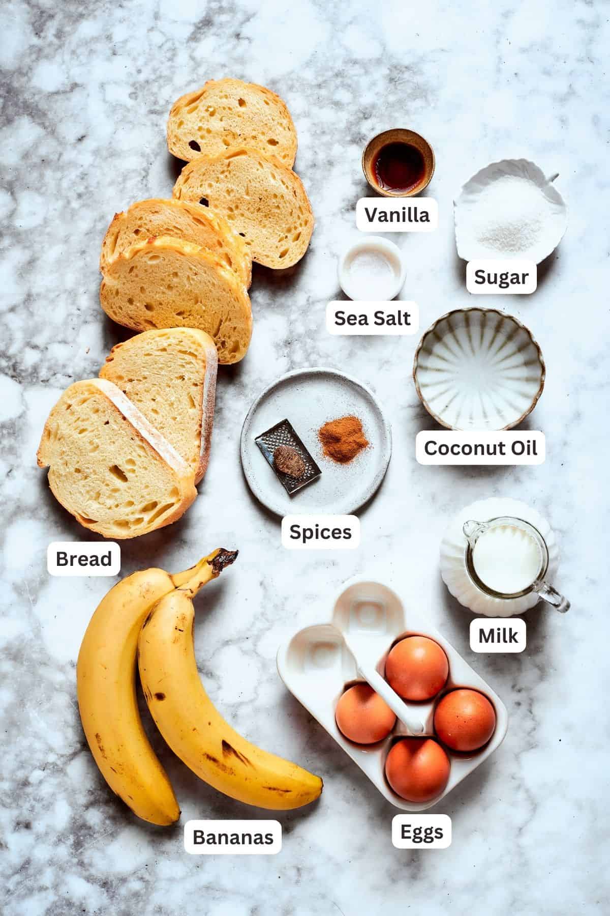 Ingredients for banana french toast are shown: bananas, bread, cinnamon, nutmeg, eggs, milk, coconut oil, salt, sugar, vanilla.