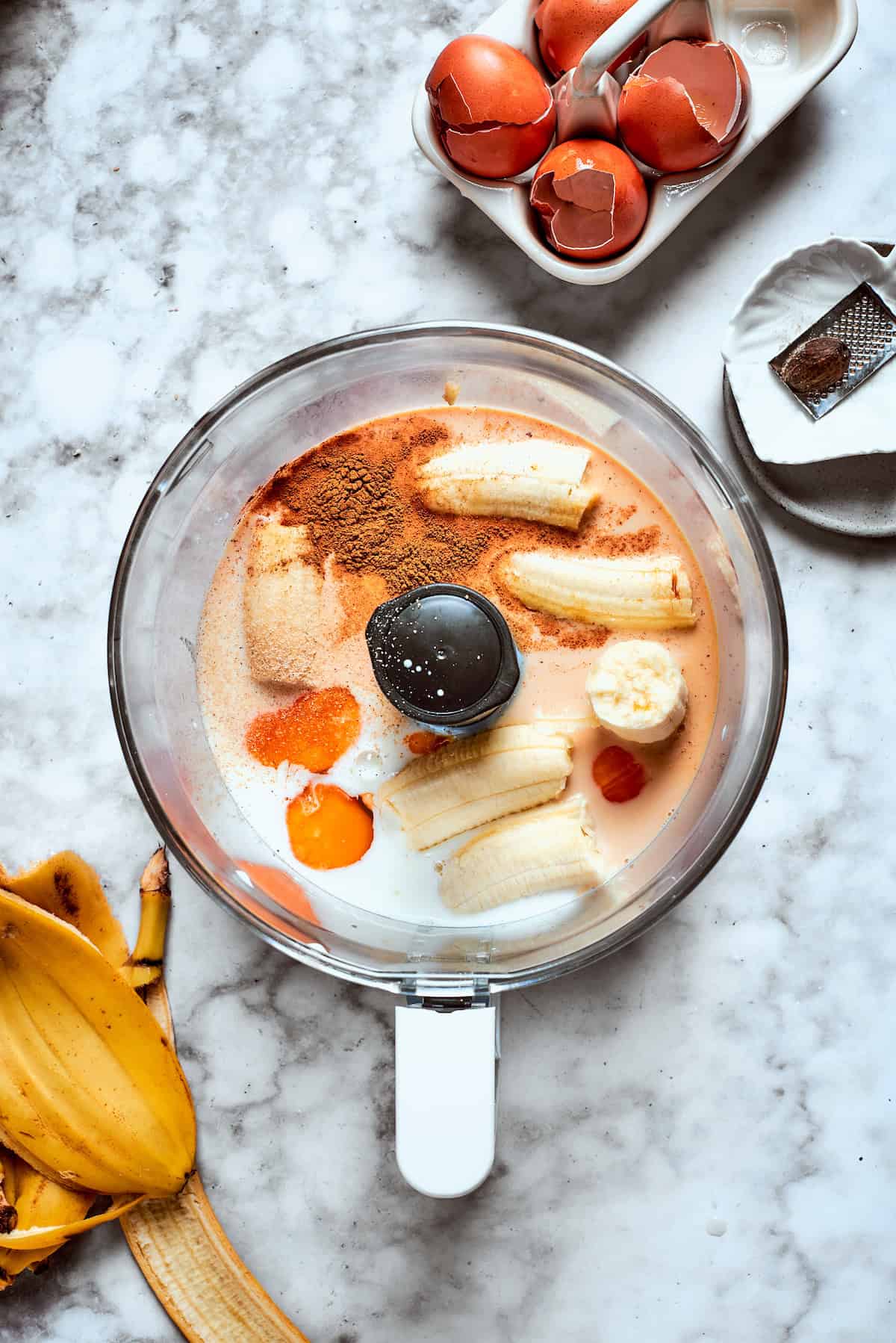 Bananas and rest of the batter ingredients are placed in a food processor.