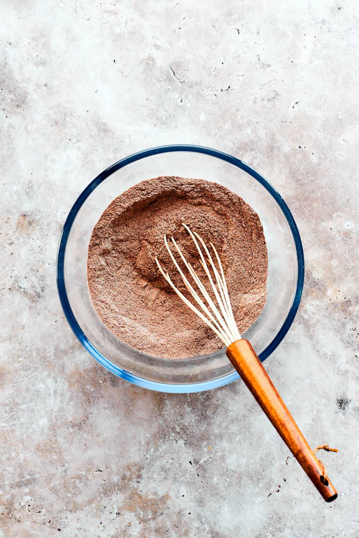 Dry ingredients for chocolate pudding cake are whisked.