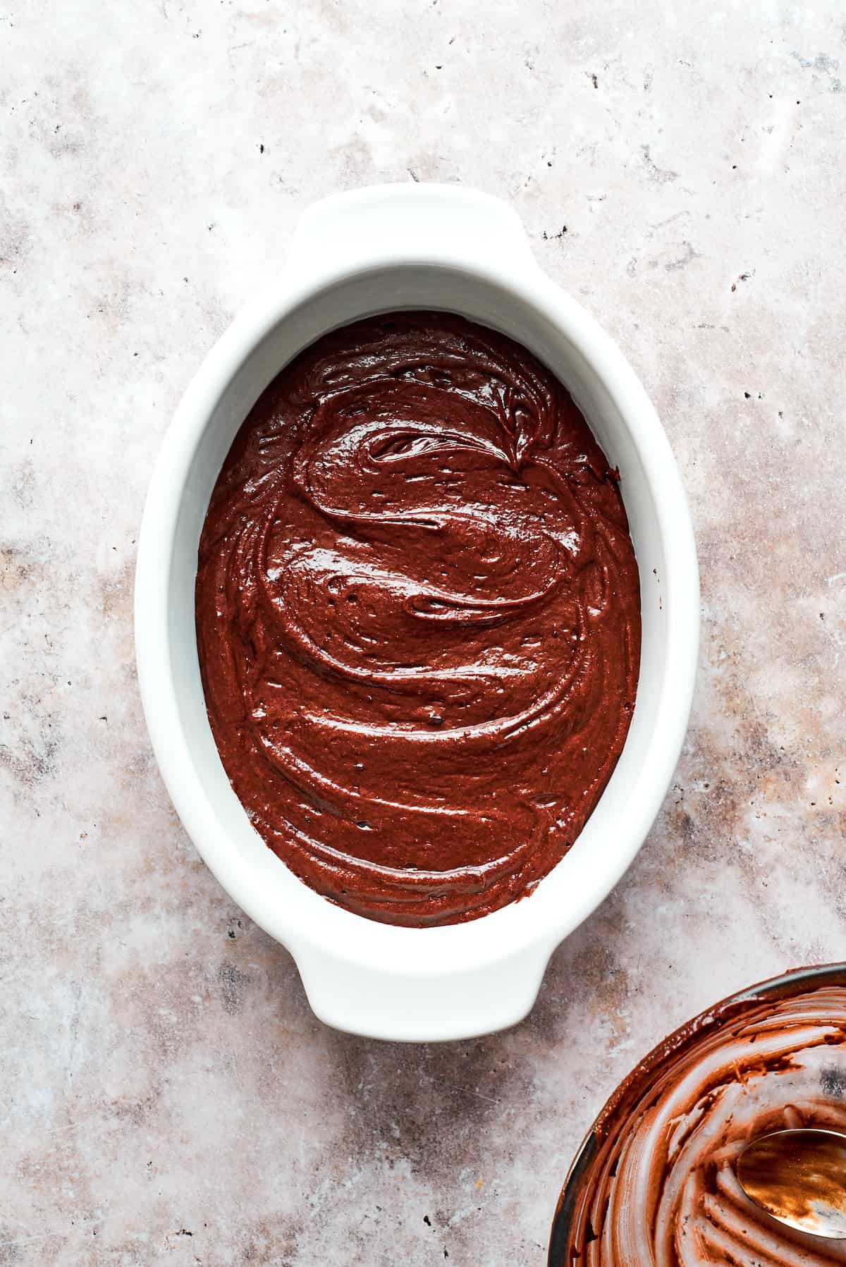 Chocolate pudding cake in an oval pan.