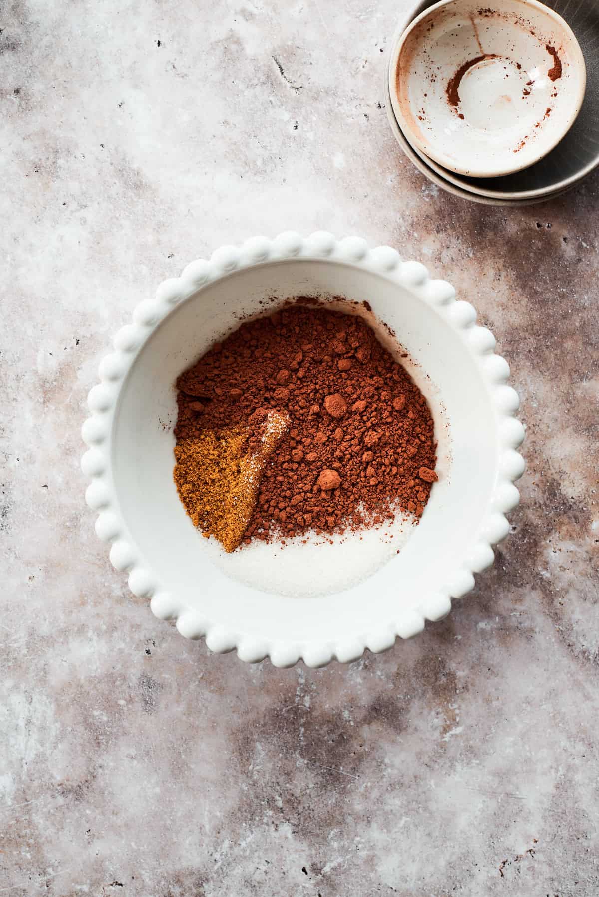 The fudge topping ingredients are added to a bowl.