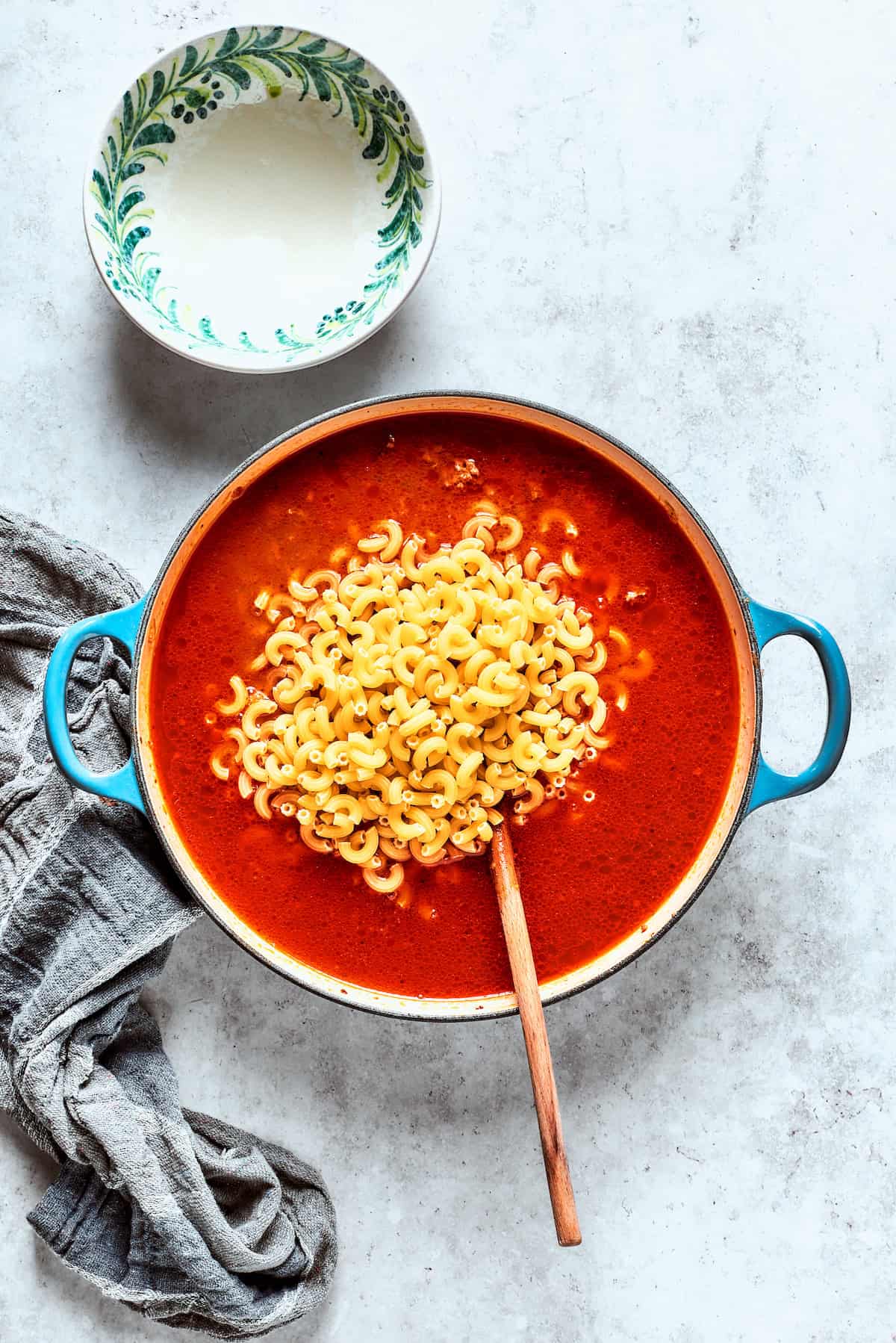 Pasta is added to the beef and broth mixture.