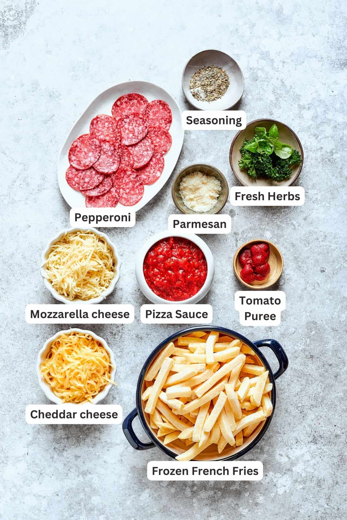 Ingredients for pizza fries include pepperoni, fries, herbs, cheddar, mozzarella, tomato puree, tomato sauce, parmesan.