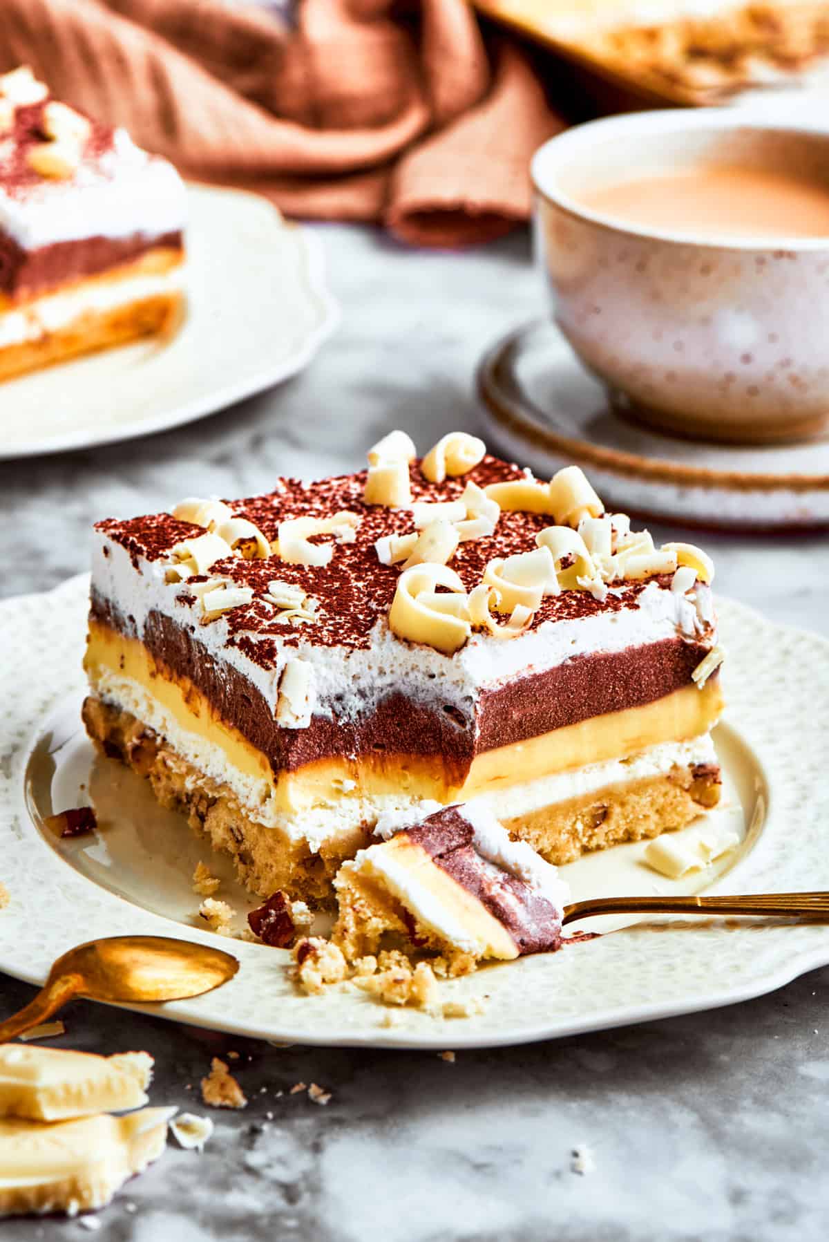 A layered chocolate and vanilla no-bake dessert called sex in a pan served on a plate.