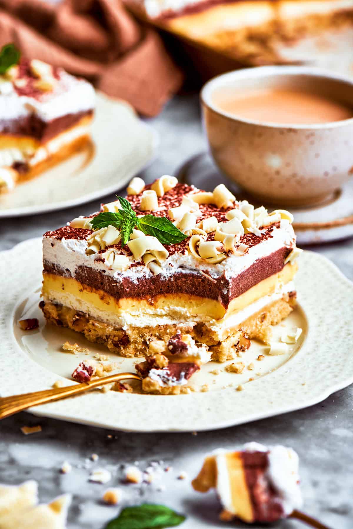 A layered no-bake dessert called sex in a pan served on a plate.