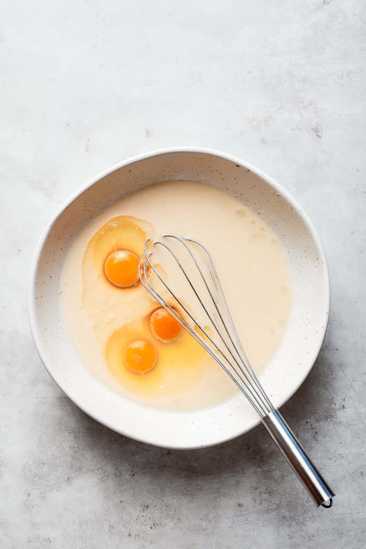 Eggs are added to the batter of Amish friendship bread.