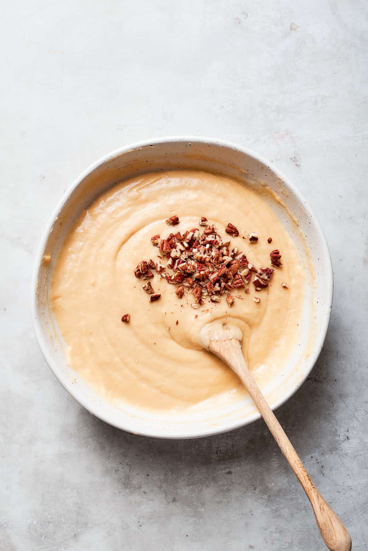 Nuts are stirred into the batter.