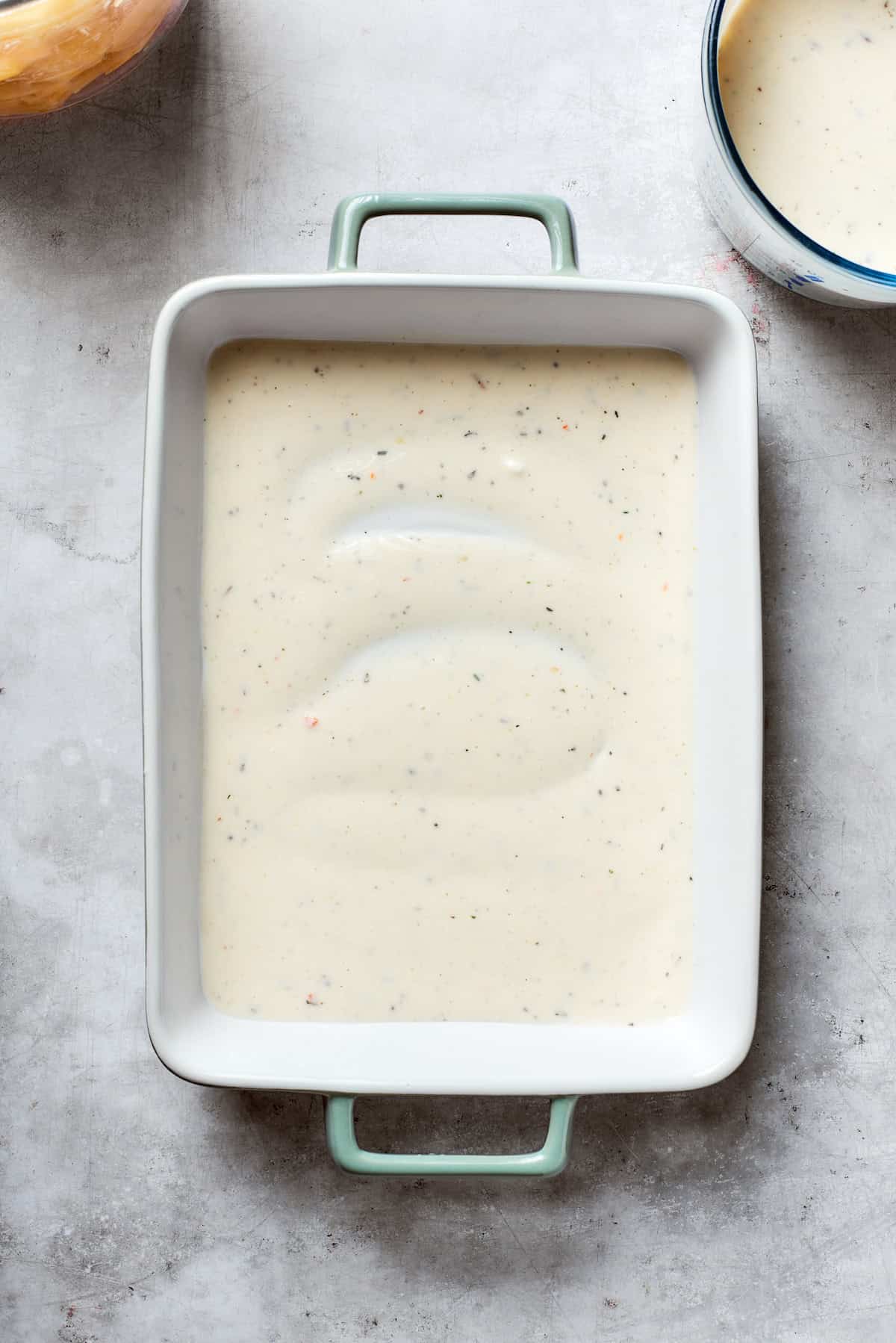 Mushroom soup is added to the bottom of the pan.