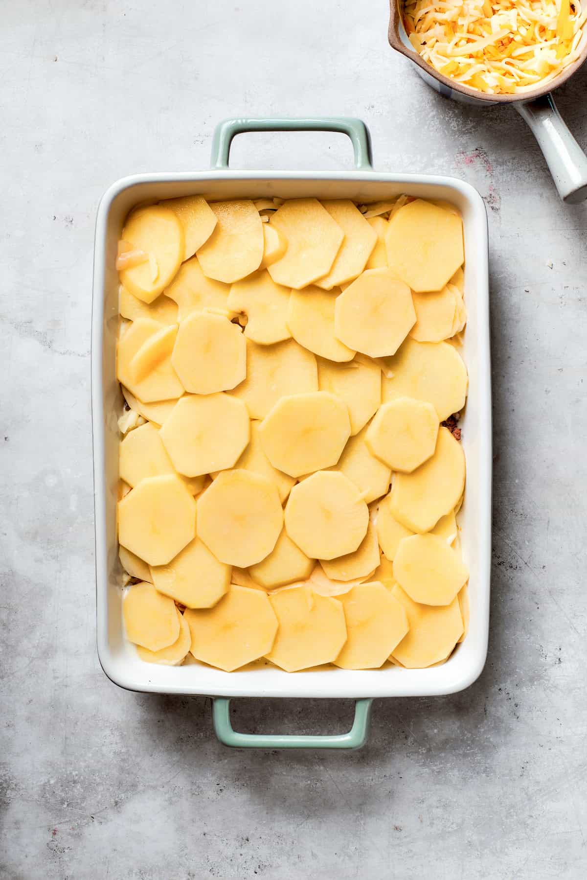 Sliced potatoes are added.