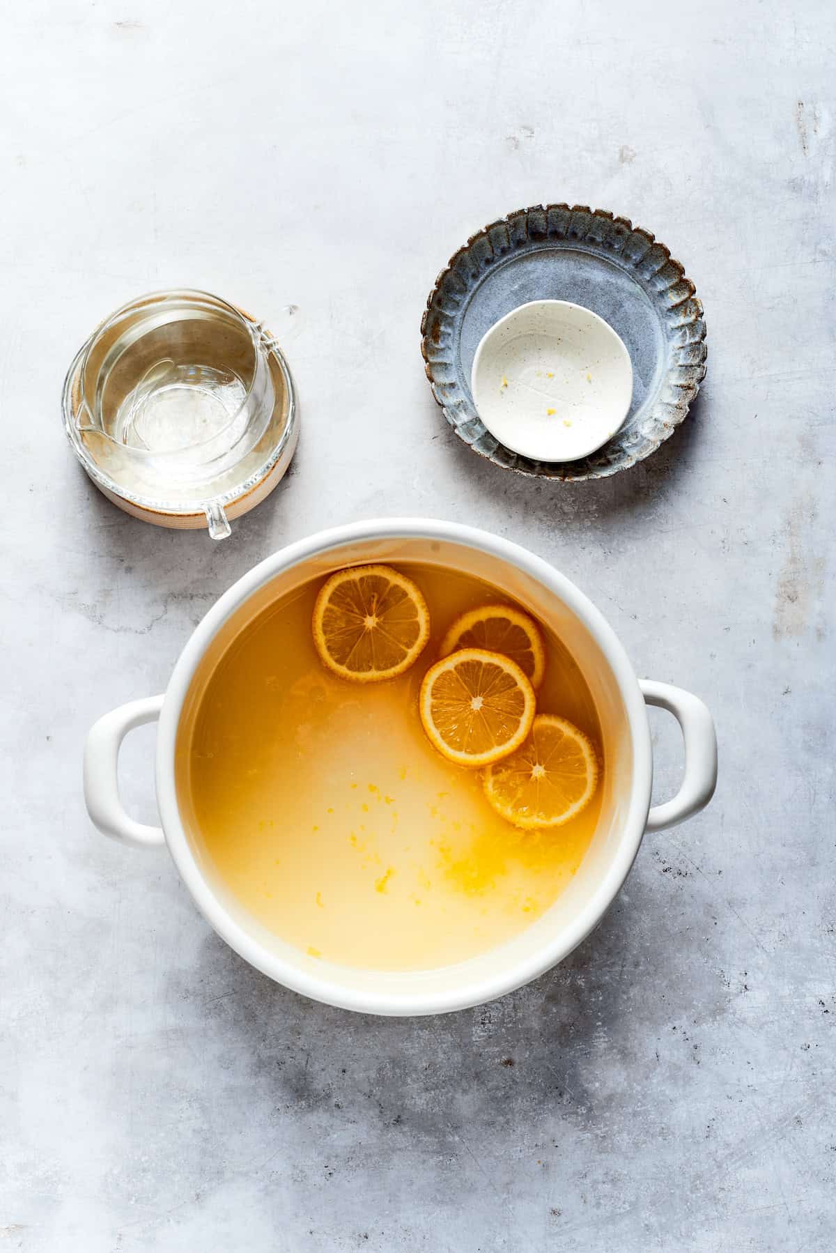 Making lemon syrup in a pot.