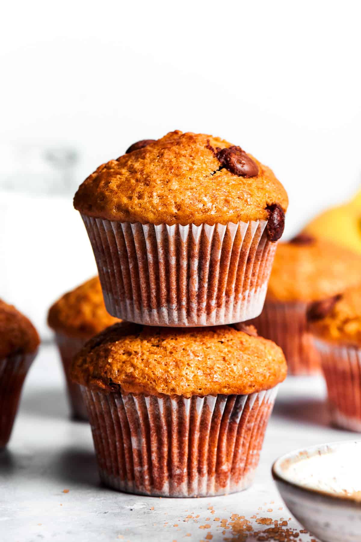 Two banana muffins, one put on top of the other.