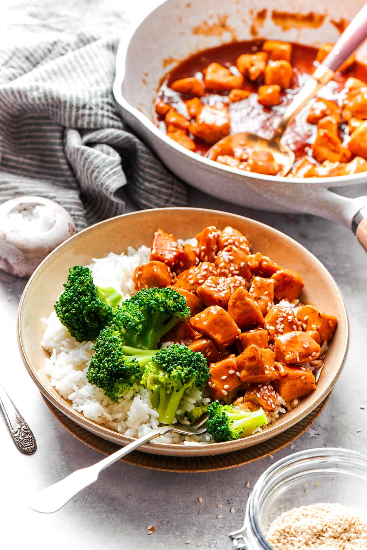 Bowls of teriyaki chicken recipe are served with rice and broccoli.