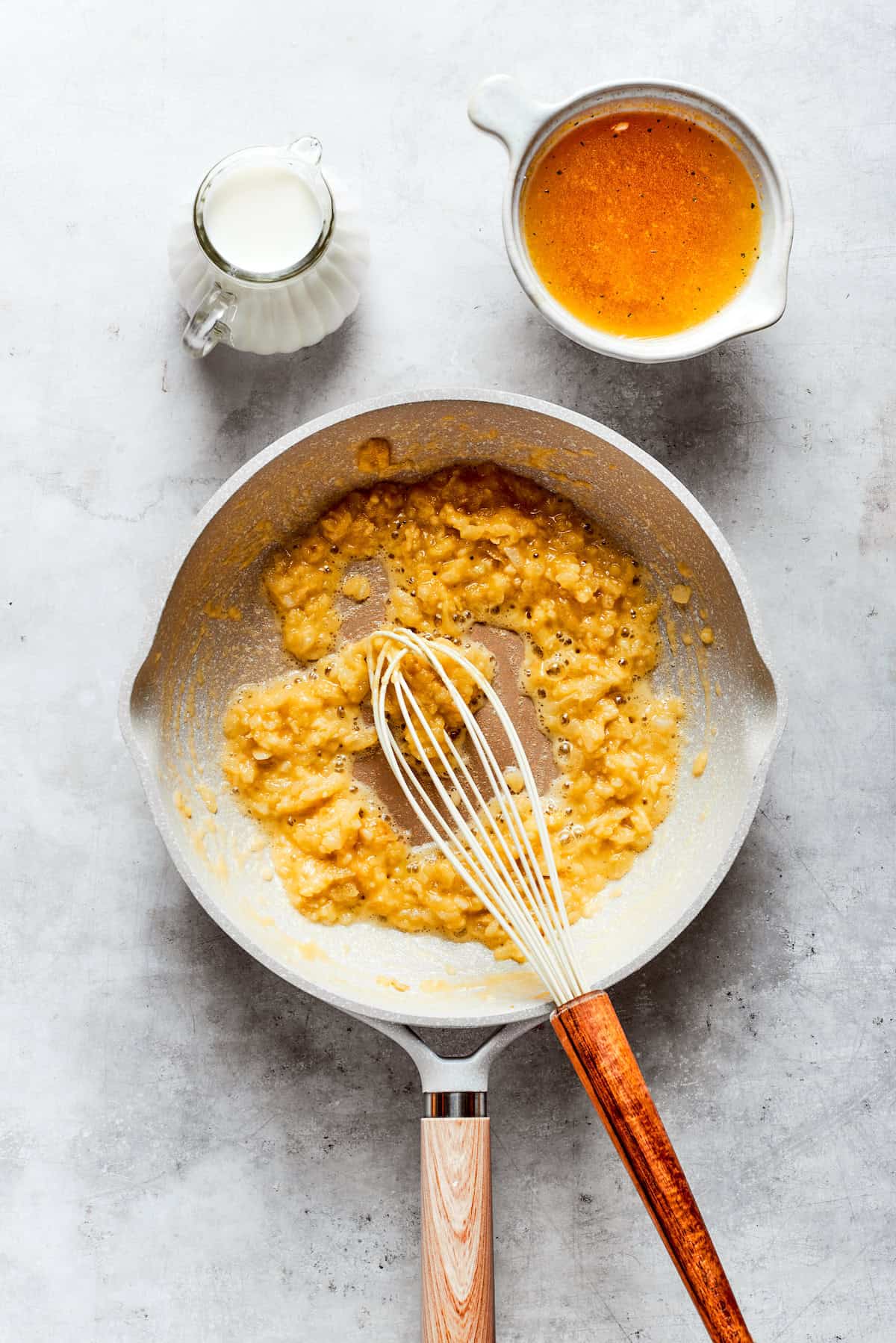 Cheddar cheese is whisked into a roux.