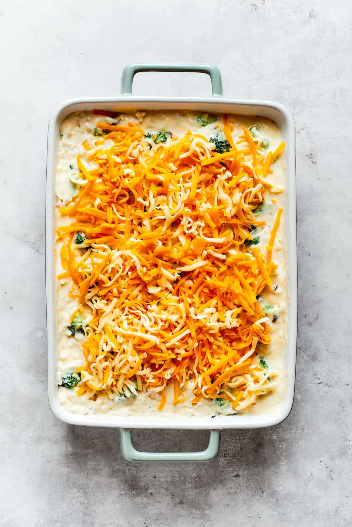 Shredded cheese tops broccoli & rice casserole.